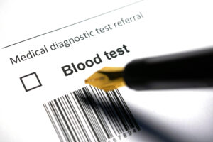 Sheet of paper labeled "Medical diagnostic test referral" and with a check box that has the words Blood test next to it